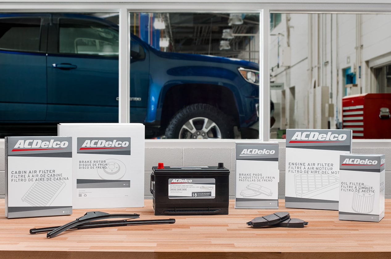 A Battery on a Table Surrounded by ACDeldo Boxes for Showcase