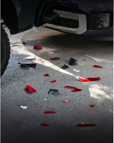 A Service Technician Inspecting a Vehicle with a Woman Standing Next to Him