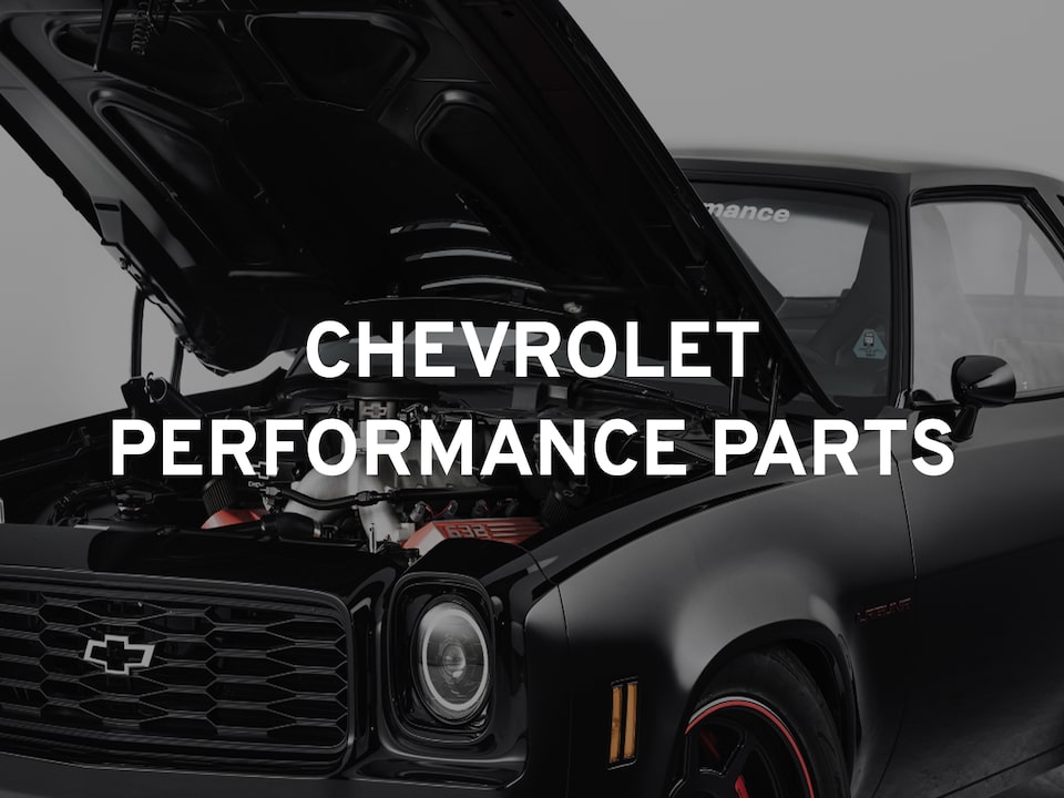 The Text "Chevrolet Performance Parts" Overlayed On A Black Chevrolet Muscle Car With The Hood Open To Show The Engine.