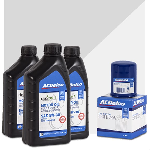 3 Black Bottles of ACDelco Motor Oil Next to an ACDelco Oil Filter with Box.