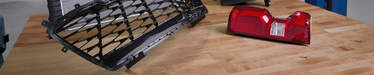 Various Vehicle Body Parts, Including Front Grille, Headlight, Taillight, and More on Display