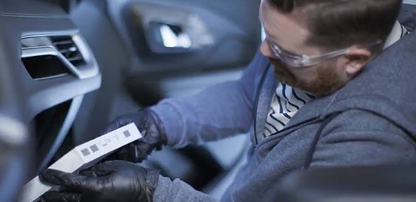 Video Thumbnail of a Mechanic Inspecting the Front Interior of a Vehicle