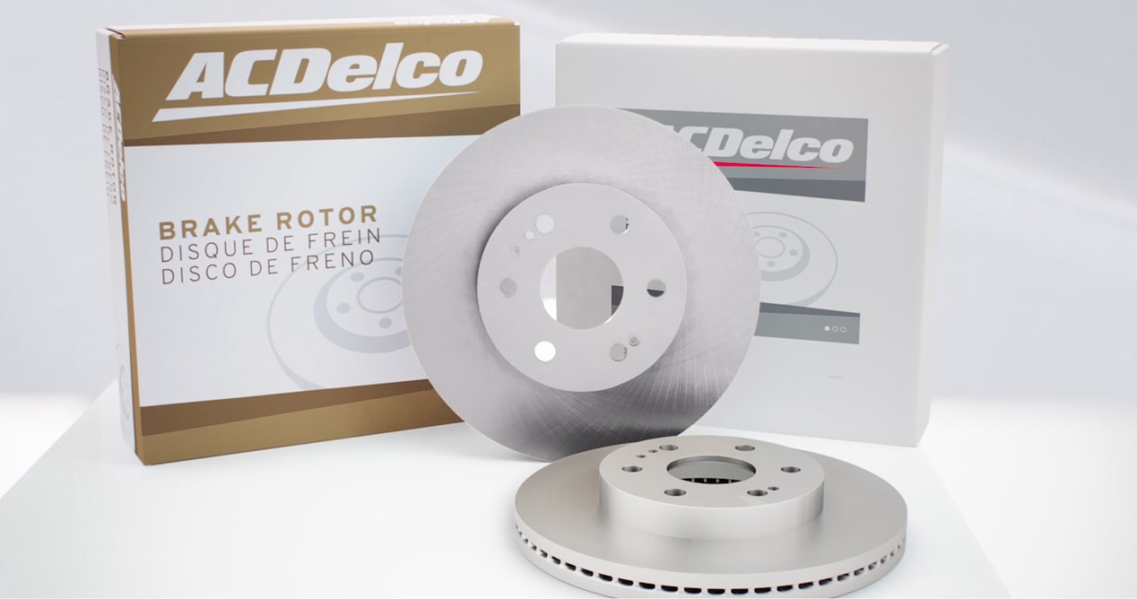 ACDelco Aftermarket Disc Brake Rotors Sitting on a Table Next to Brake Rotor Boxes
