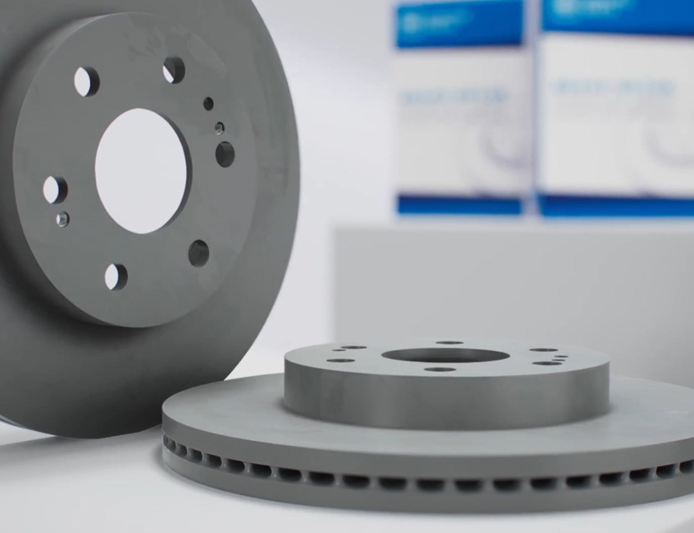 Video Thumbnail Close-up of Two GM Genuine Parts Brake Rotors Displayed on a Table
