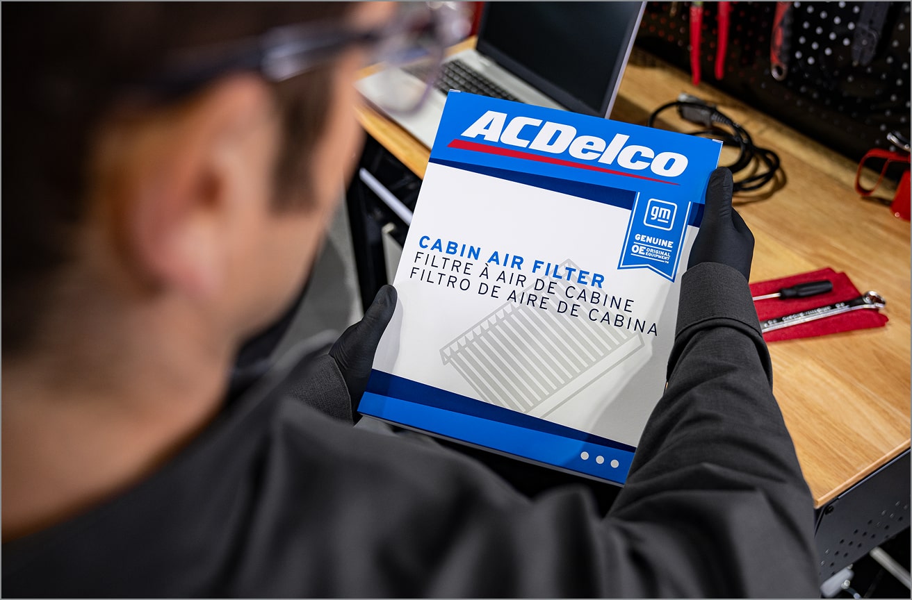 A Certified Technician Holding an ACDelco Air Filter.