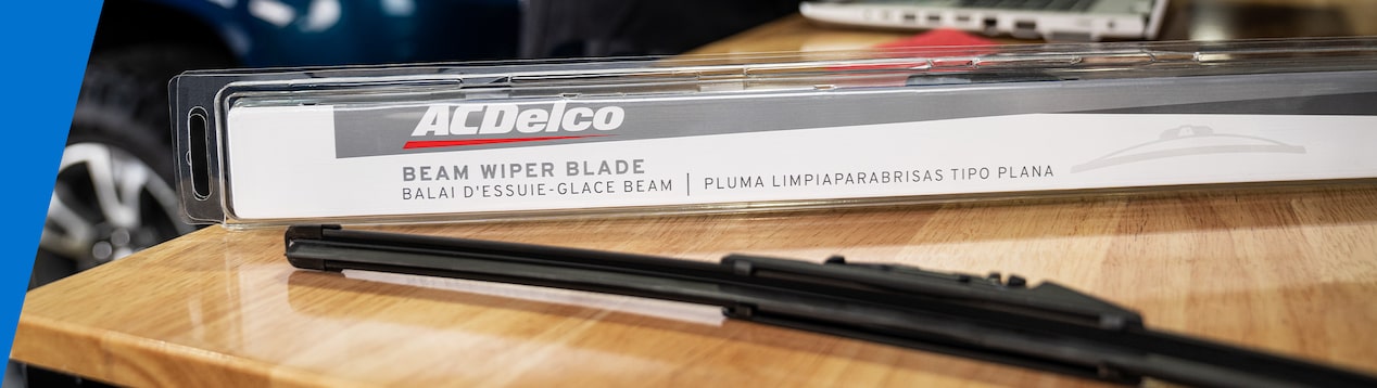Wiper Blade Laying on a Table with the AC Delco Packaging Laying Next to It