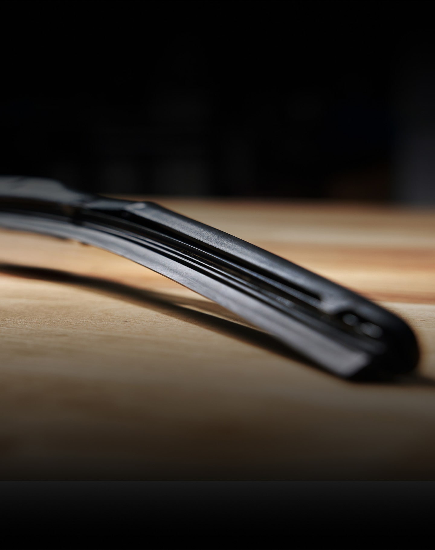 Close-up of a Black Wiper Blade on a Table
