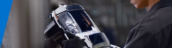 GM Technician Inspecting a Taillight