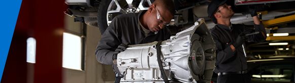 GM Technician Inspecting a Transmission